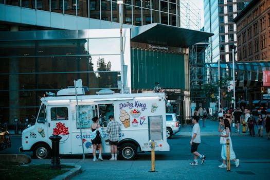 A vibrant street scene in Toronto featuring an ice cream truck and pedestrians.