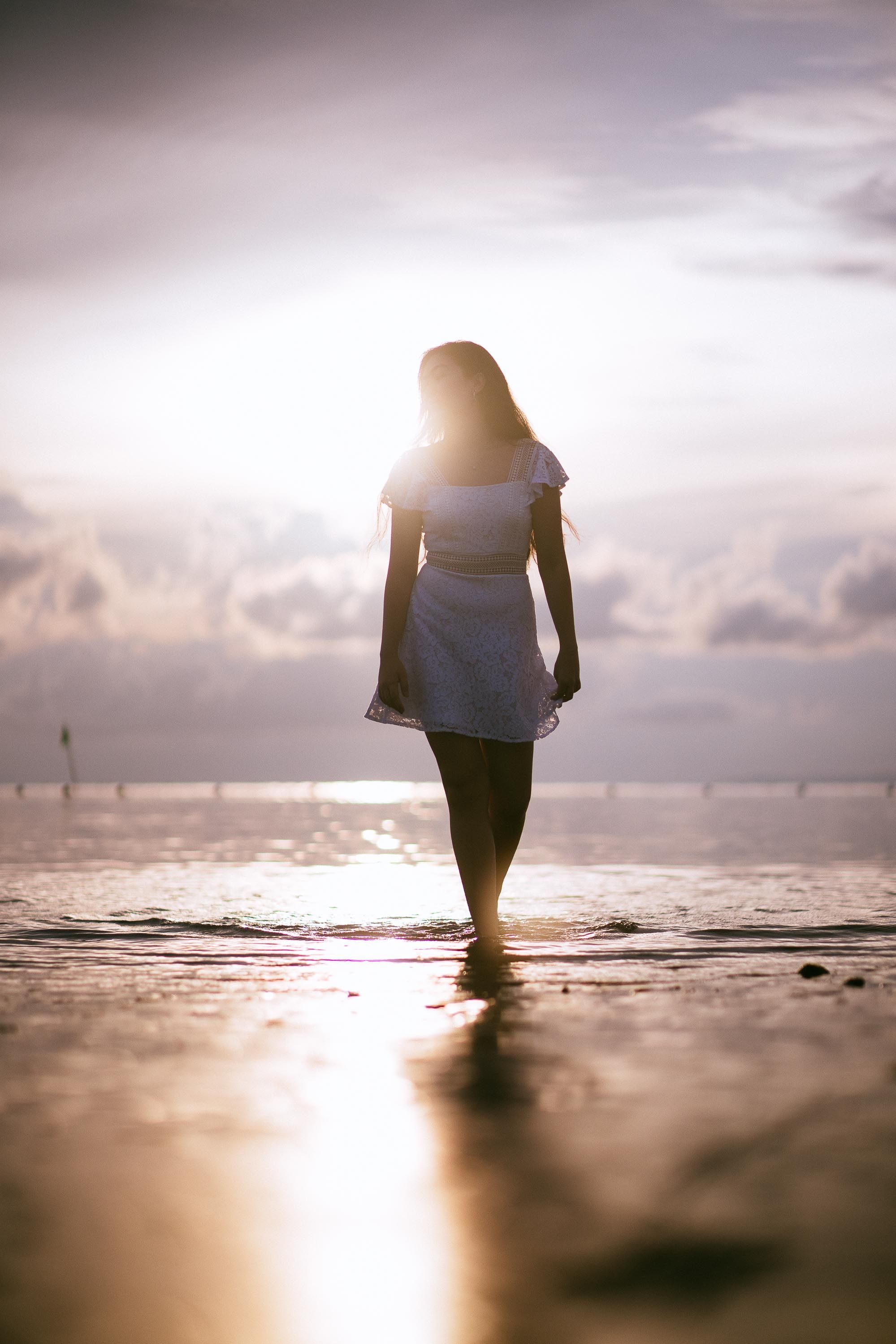 Woman in White Dress Standing on Beach · Free Stock Photo