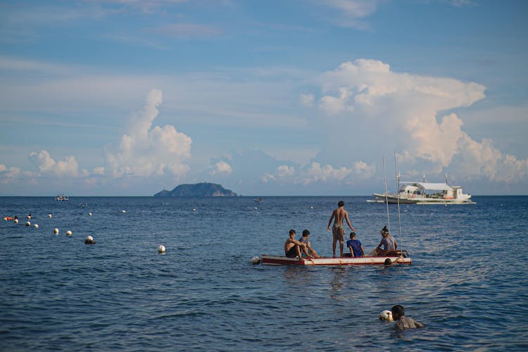 People Riding On A Boat