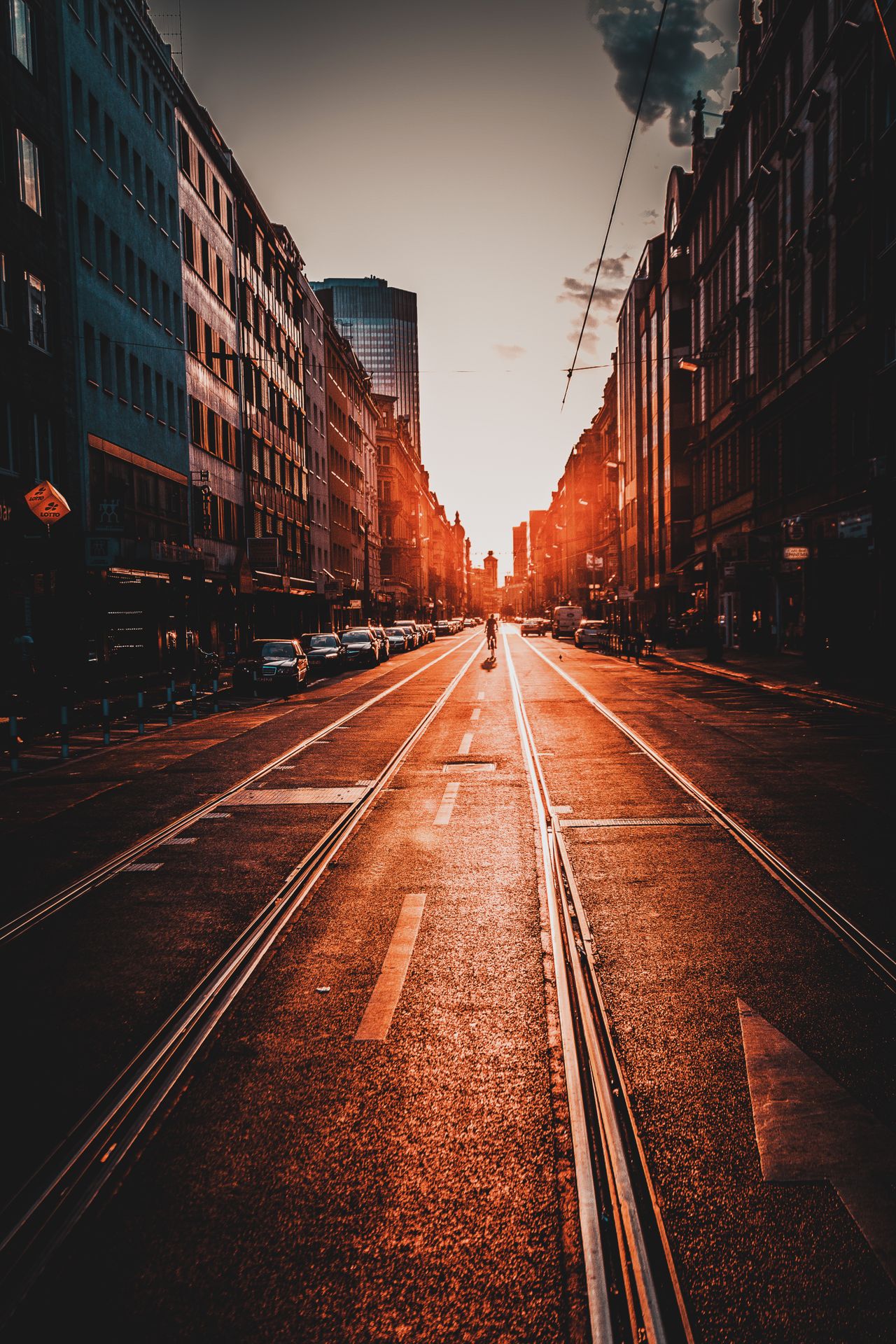 Frankfurt street at sunset with tram tracks