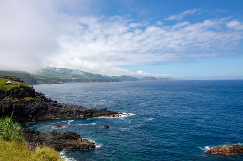 Free Stunning aerial view of the coast with a clear blue sea and sky, perfect for travel inspiration. Stock Photo