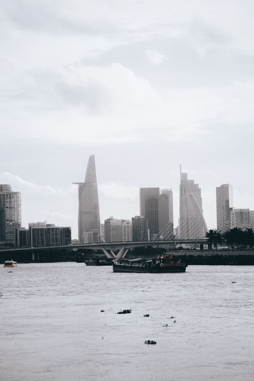 Free Scenic view of Ho Chi Minh City's skyline with river foreground, showcasing modern architecture. Stock Photo