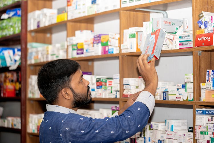 Professional Pharmacist In Modern Drugstore, Space For Text