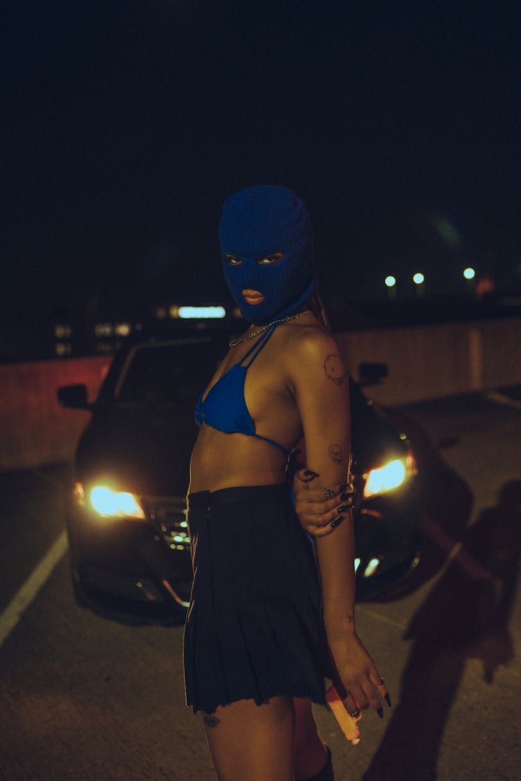 Woman In Black Tube Dress Wearing Blue Mask