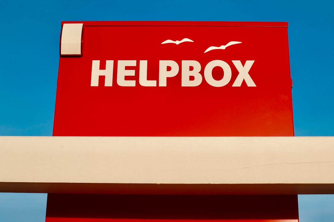 Helpbox Logo against Blue Sky