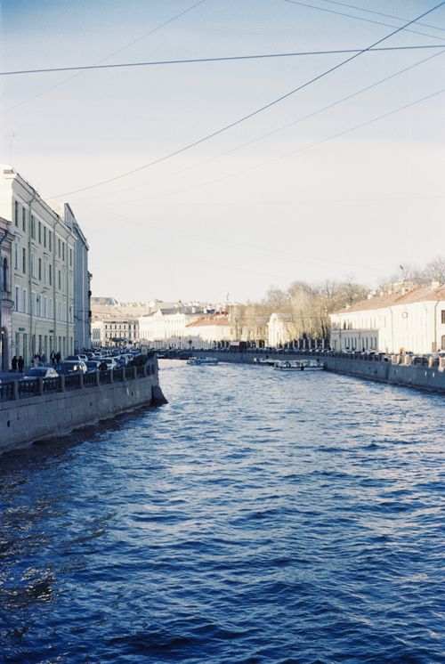 Free Tranquil riverside view with historic buildings in Saint Petersburg, Russia. Stock Photo