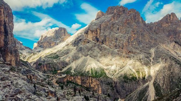 Majestic view of the Dolomites mountains under a bright summer sky in Italy.