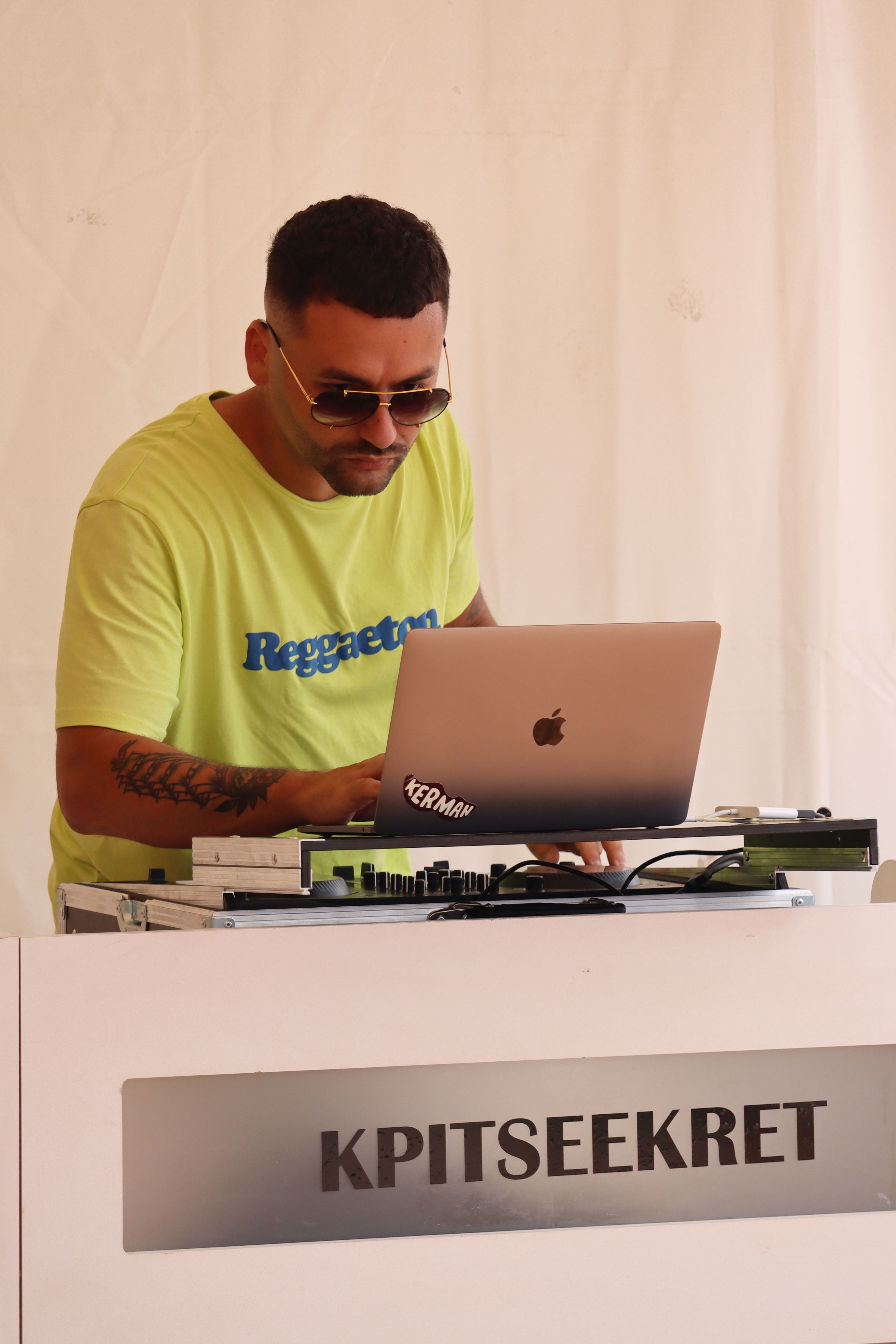 A Disc Jockey Performing On A Nightclub While Wearing Shades Free a-disc-jockey-performing-on-a-nightclub-while-wearing-shades-free
