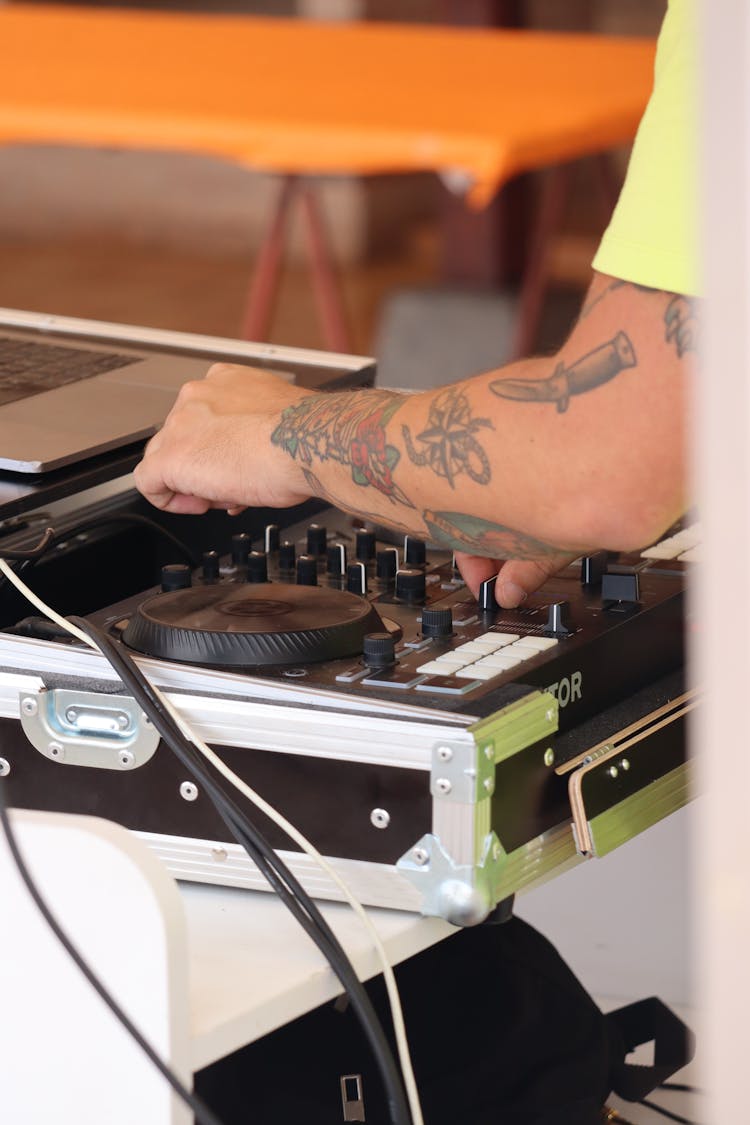 Person Using A Dj Mixer