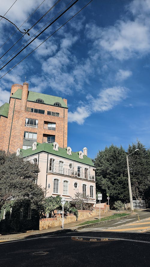 A Brown and White Building Under Blue Sky