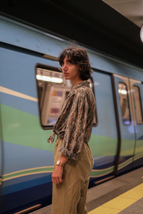 Fashionable Woman Standing near a Train