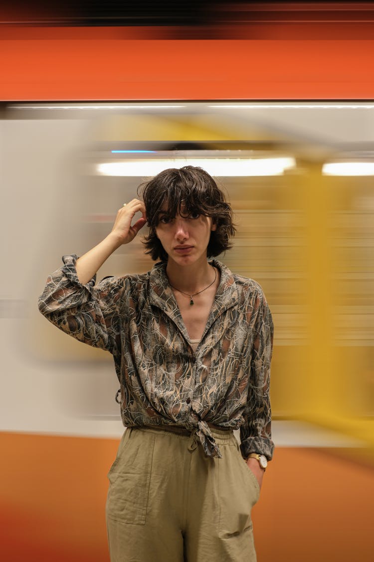 Woman Posing Near A Moving Train