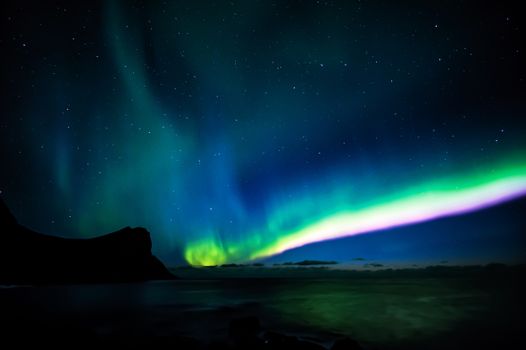 Stunning display of the Aurora Borealis lighting up the night sky over Myrland, Viken, Norway.