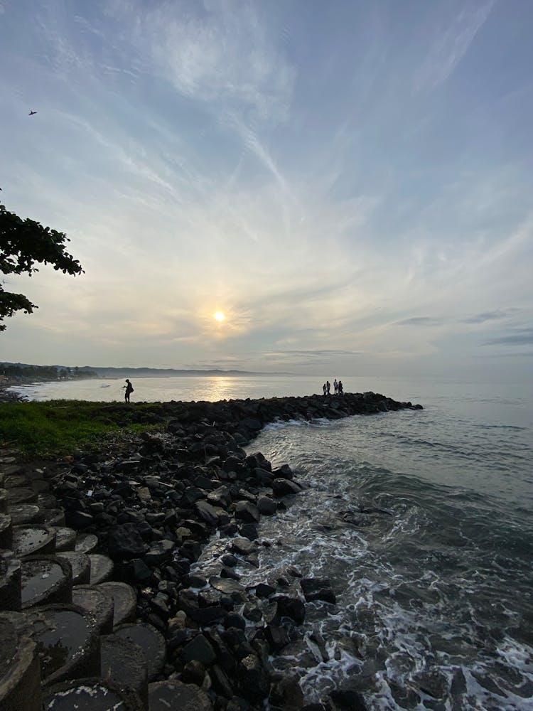 People On The Coast At Sunset 