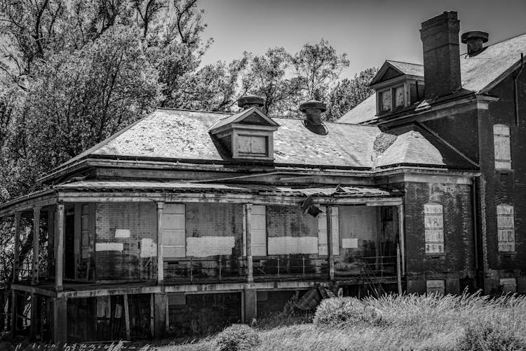 Grayscale Photo Of An Old House 