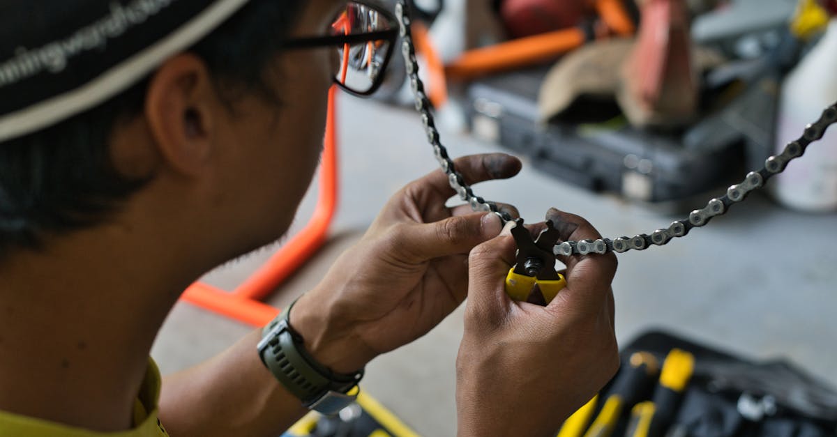 Bike Mechanic Fixing a Chain · Free Stock Photo