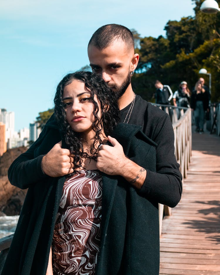 Man Embracing Brunette Woman