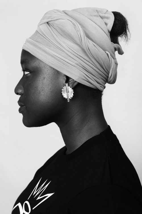 Free Black and white side view portrait of an adult woman wearing a headscarf. Stock Photo
