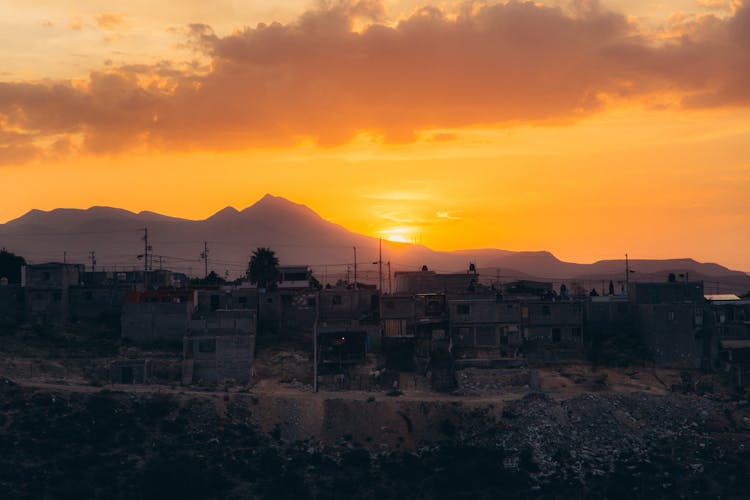 Silhouette Of Houses During Sunset