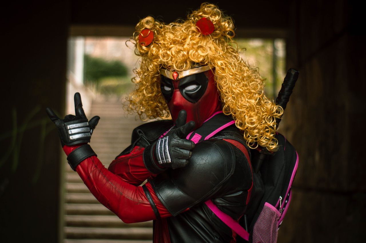 a unique blend of deadpool and sailor moon in an outdoor cosplay shoot