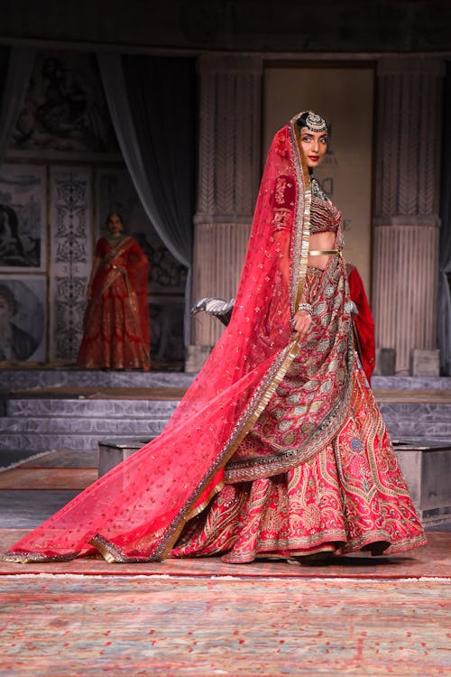 Model Standing in Red Sari