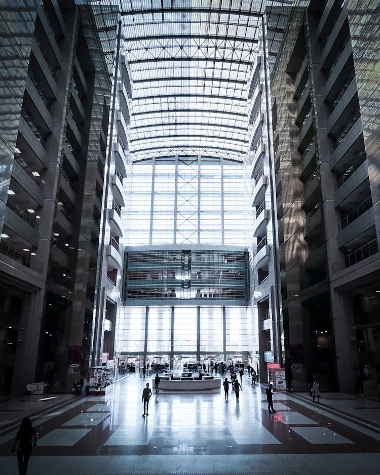 People Walking Inside The Building