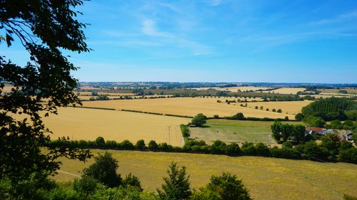 Free Breathtaking aerial view of expansive farmland in Sharpenhoe, UK under clear blue skies. Stock Photo