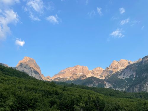 Free Stunning view of the majestic Valbonë Valley mountain range under a clear blue sky in Albania. Stock Photo