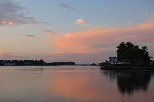 Free Beautiful sunset reflecting over a tranquil lake in Stamford, Connecticut, USA. Stock Photo