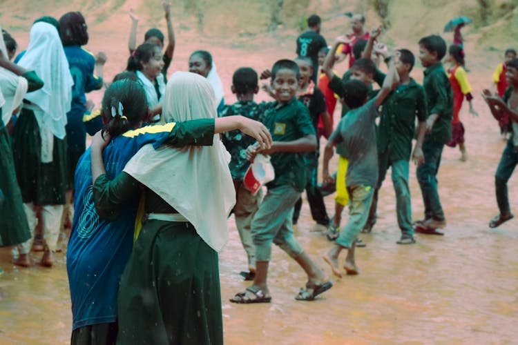 Children Playing On Mud