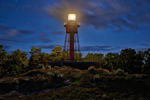 Free Illuminated Lighthouse During Night Time Stock Photo