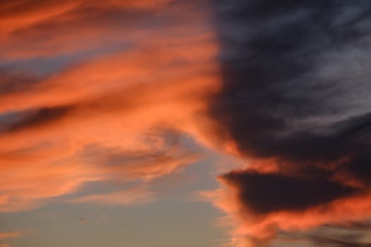 A vibrant cloudscape with stunning colors during sunset, showcasing natural beauty in the sky.