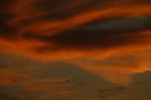 Free Captivating view of orange clouds at sunset creating a dramatic atmosphere. Stock Photo