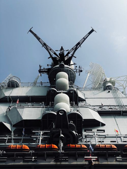 Free Low angle view of a military navy ship under a clear sky, symbolizing strength and power. Stock Photo