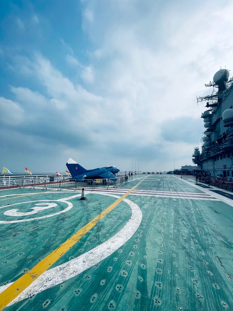 Blue Aircraft On Ship