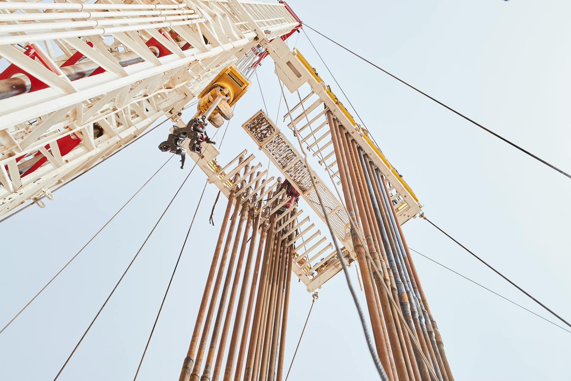 Dynamic low angle view of an oil rig structure in Al Wafrah, Kuwait.