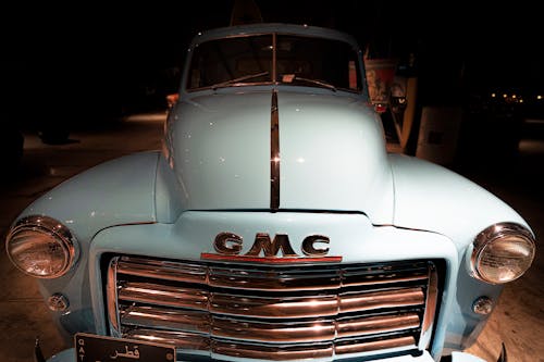 Close Up Photo of a Light Blue Pick Up Truck