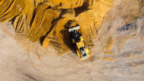 Free Excavator on Sand Mound Stock Photo