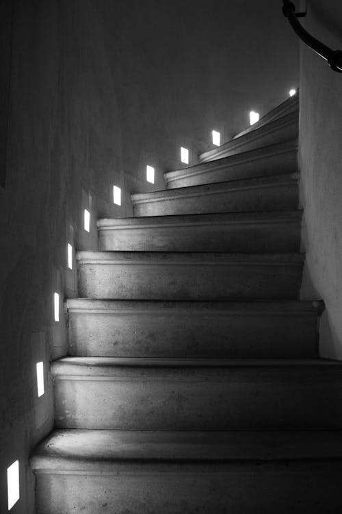 Grayscale Photo of a Concrete Staircase