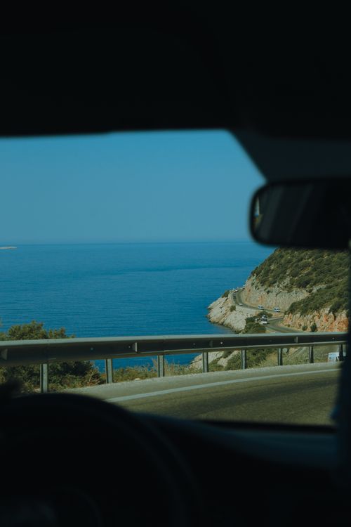 Free Enjoy a serene coastal road drive in Muğla, Türkiye with expansive ocean views. Stock Photo