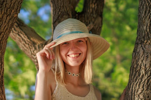 Free Close-Up Shot of a Woman Wearing Sun Hat Stock Photo