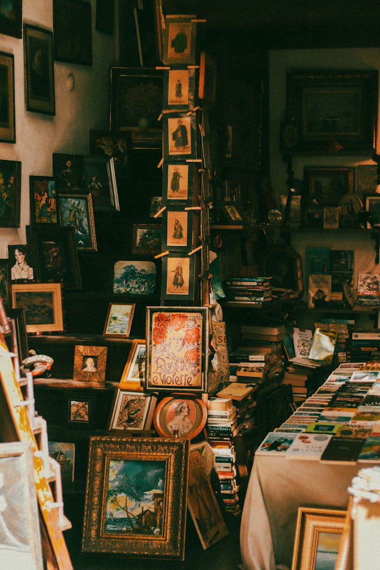 Assorted Books And Picture Frames In A Vintage Shop 