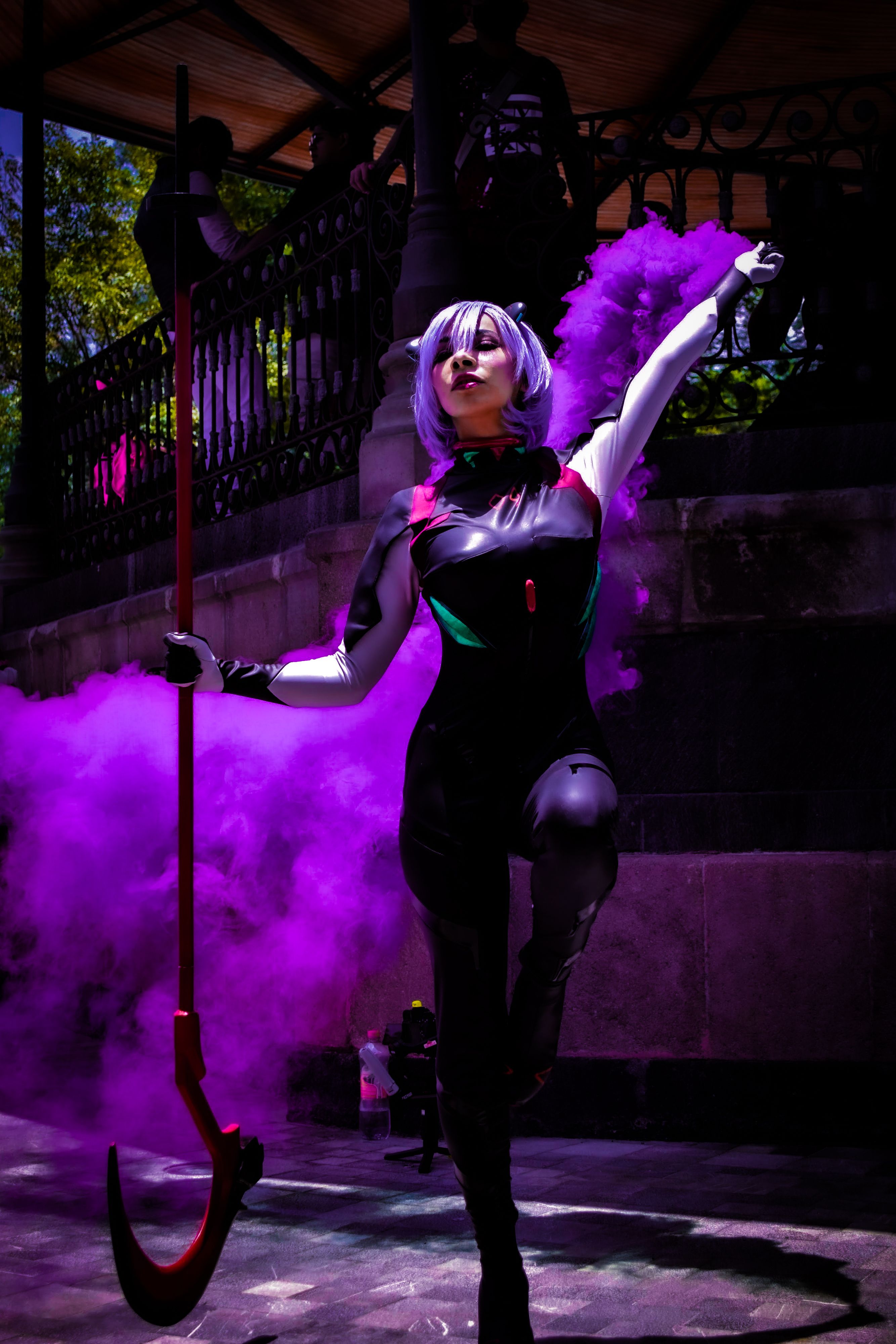 Striking cosplay performance with vibrant purple smoke in Hidalgo, Mexico.
