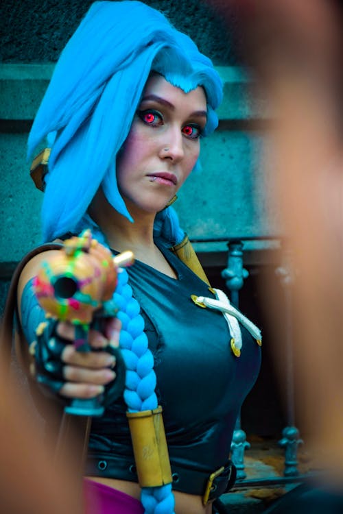 Woman in Cosplay Costume with Gun