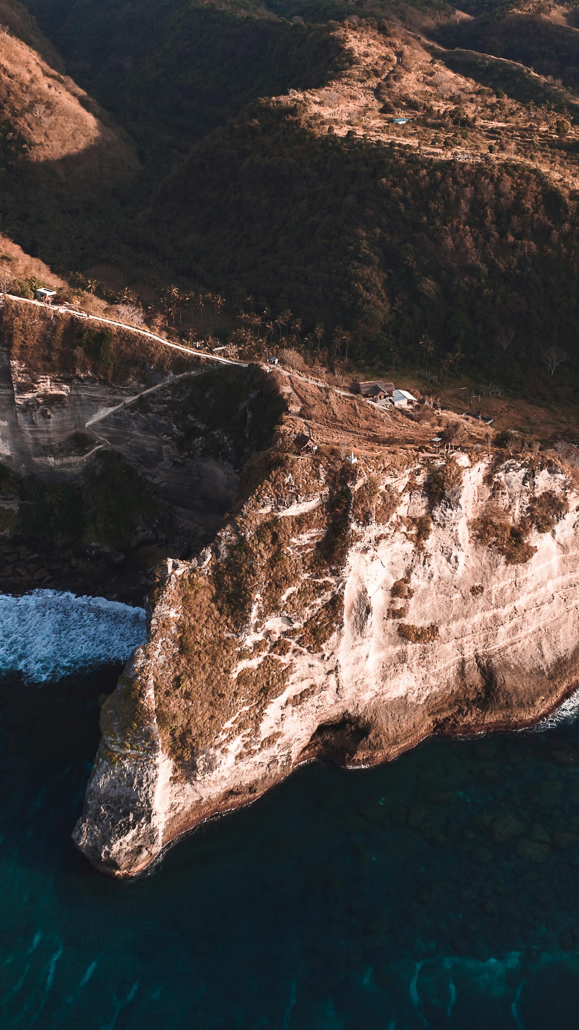 Cliff over Beach on Sea Shore · Free Stock Photo