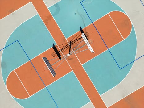Drone shot of a colorful basketball court in Campbell, California, showcasing geometric designs.
