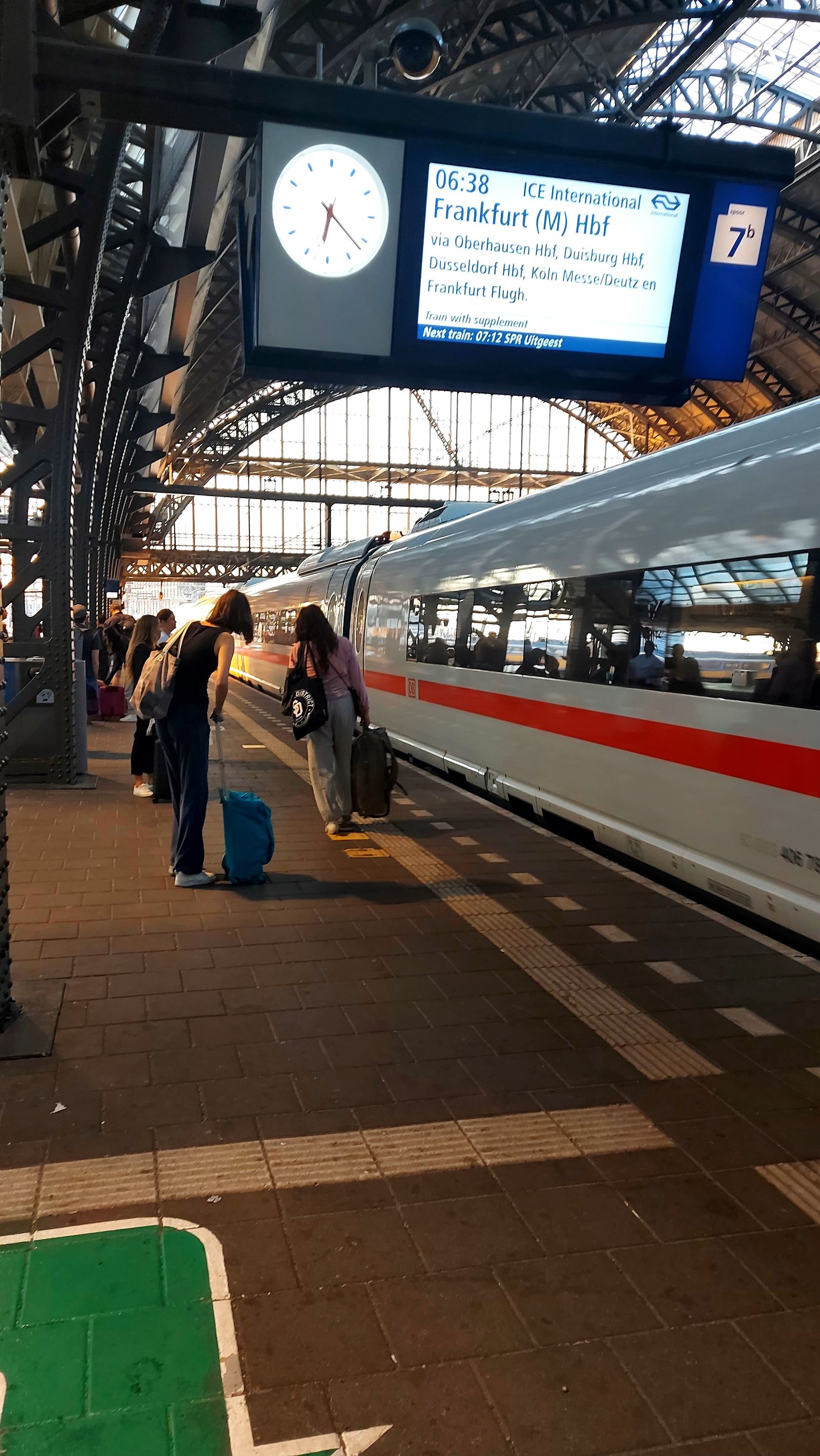 A high-speed train standing at a European railway station