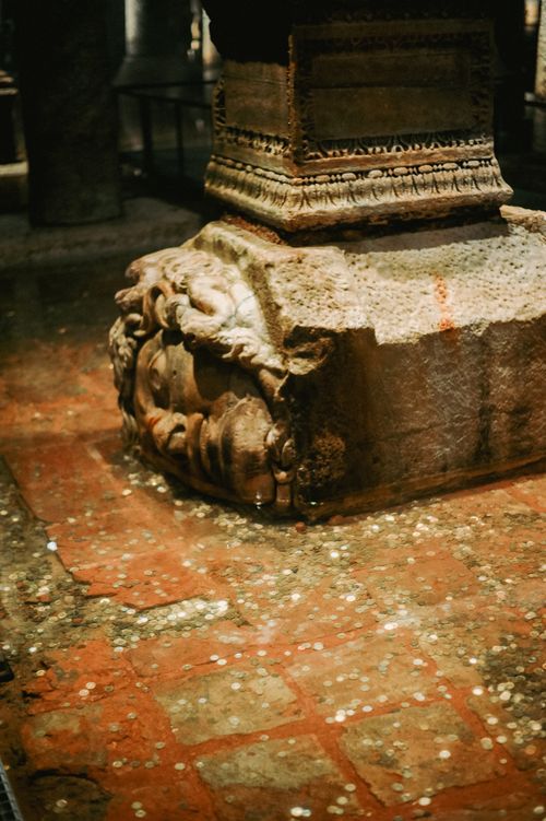 Free Explore the ancient Medusa head column in the historic Basilica Cistern of Istanbul, a key tourist site. Stock Photo