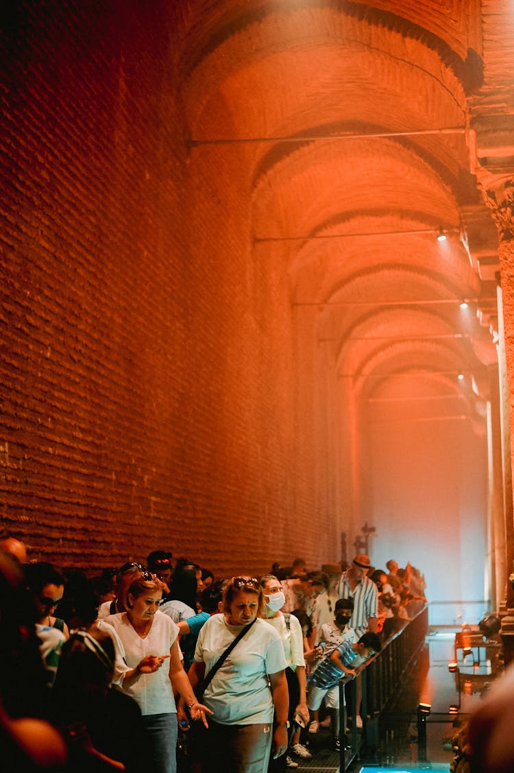 People Standing In Line In Museum