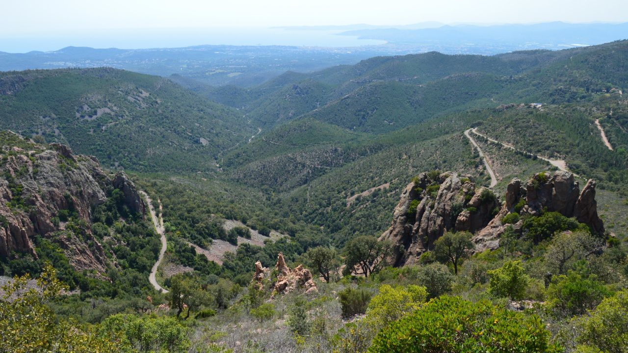 breathtaking view of lush green valleys and rugged mountains under a c